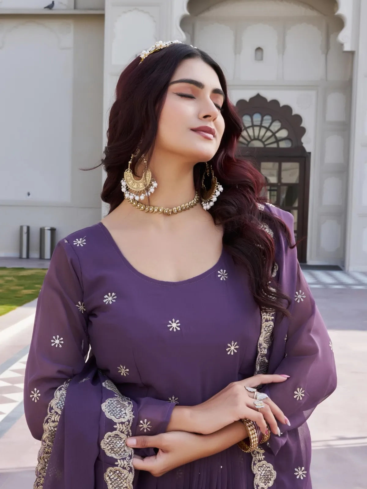 Tarani purple georgette gown upper body view showing neckline and jewellery details - Ishivitika