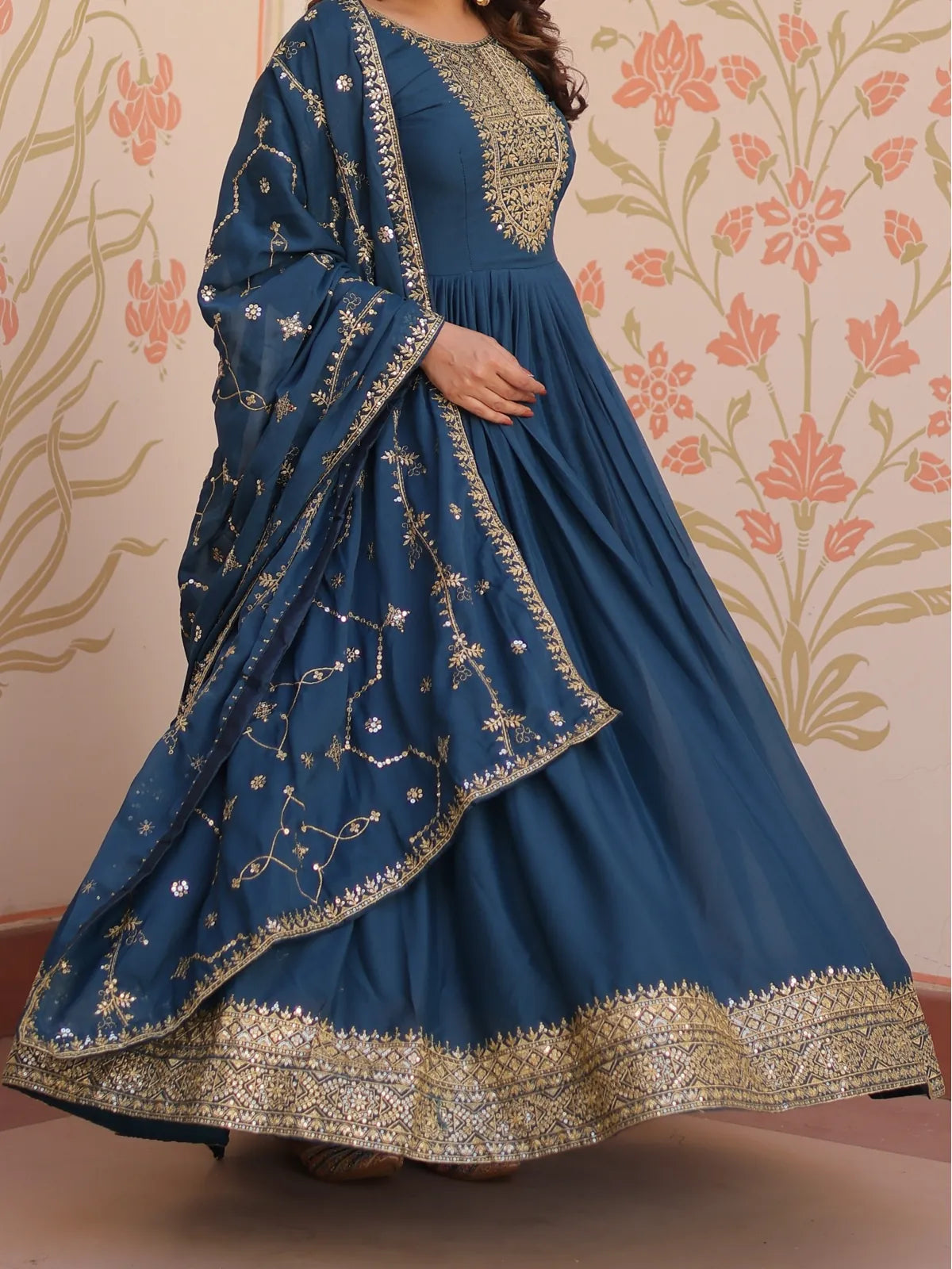 Tarani teal georgette gown front view highlighting golden embroidery and flared dupatta