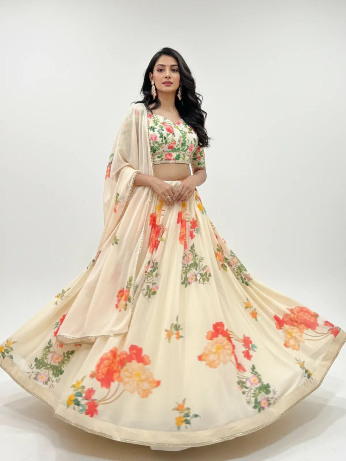 Tarani cream floral georgette lehenga with bright printed flowers and 4 meter flair in a full twirl pose