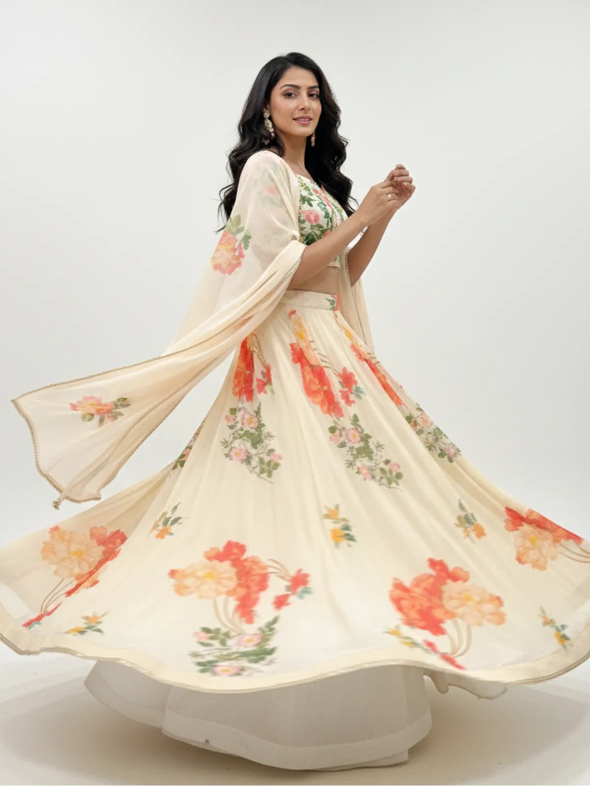 Tarani designer georgette lehenga in cream with multicolor floral print shown in mid-twirl side pose