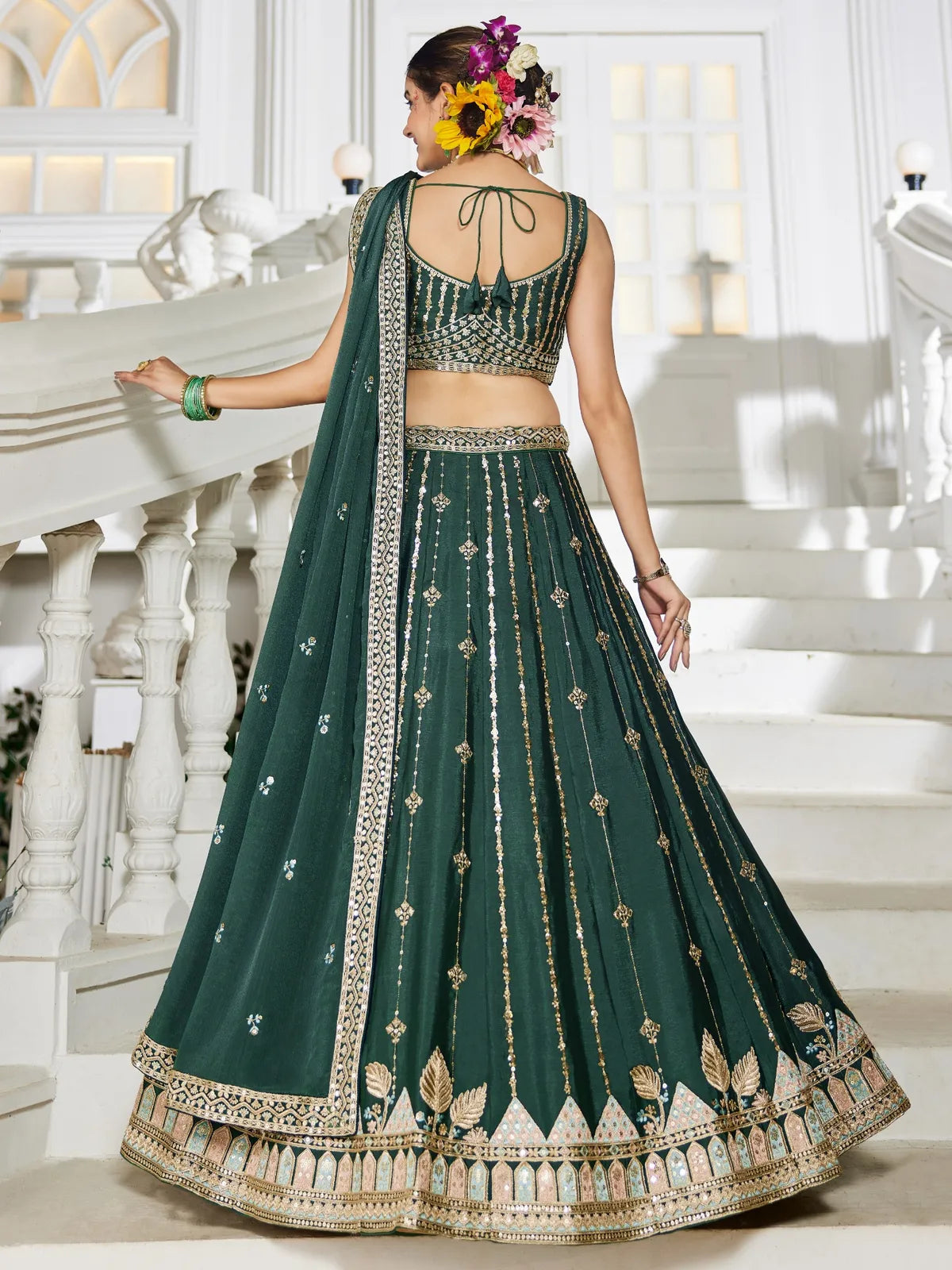 Tarani green georgette lehenga back view with blouse tie-up and flared skirt
