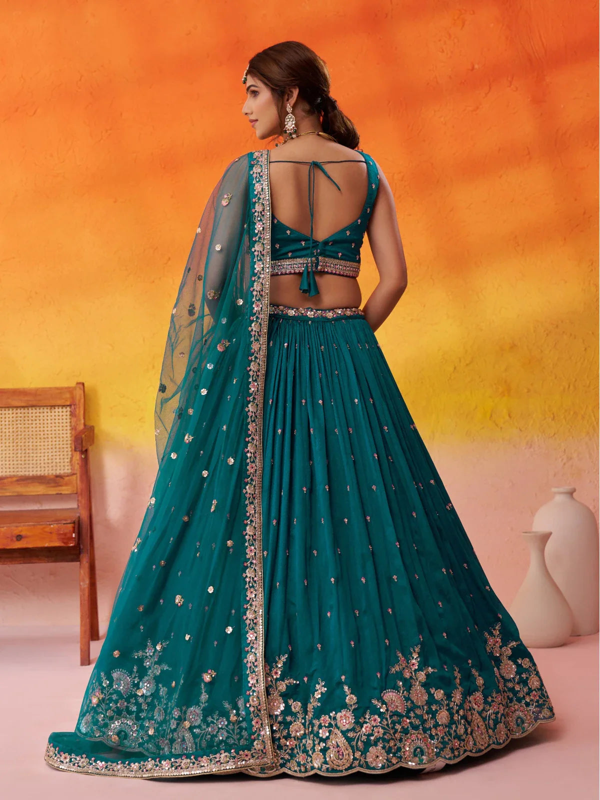 Tarani lehenga green georgette fabric full back view with tassel tie blouse and sequin details