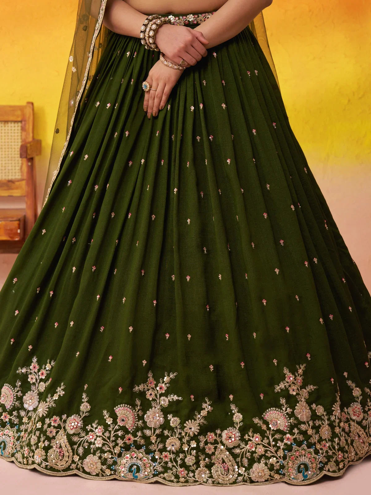 Tarani closeup of lehenga embroidery border with floral thread and sequin detailing