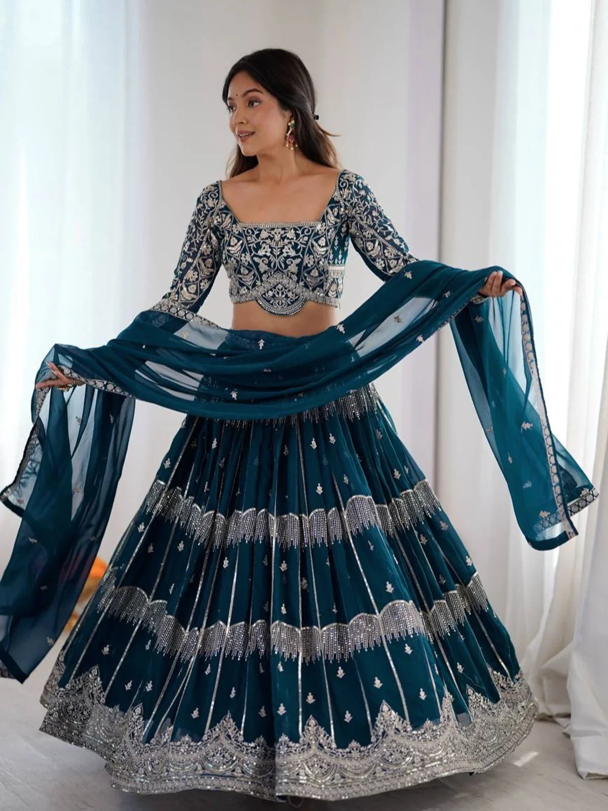 Tarani teal georgette lehenga with thread and sequin embroidery full view with dupatta and flare