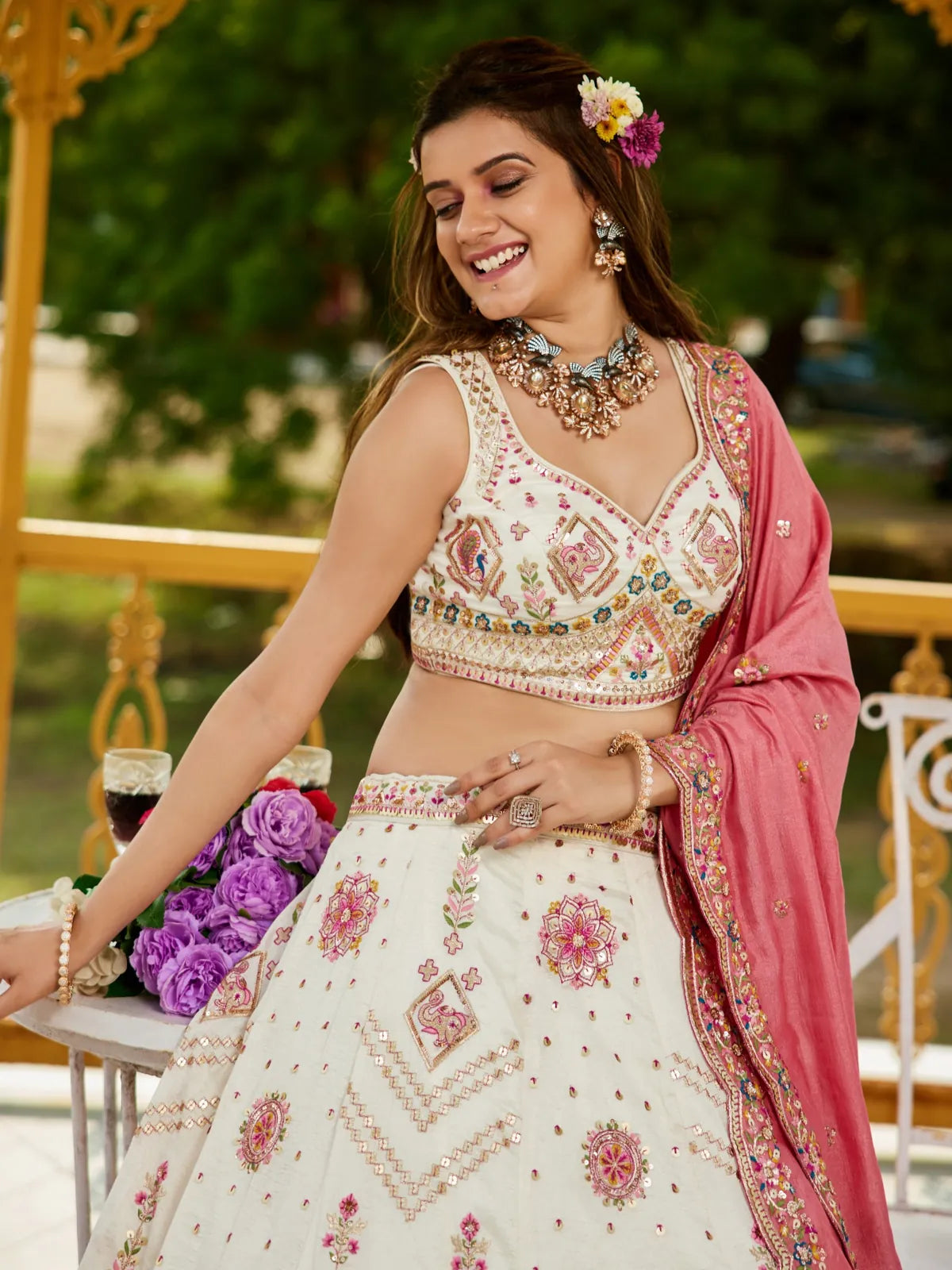 Tarani green georgette lehenga upper body closeup showing blouse embroidery and jewelry