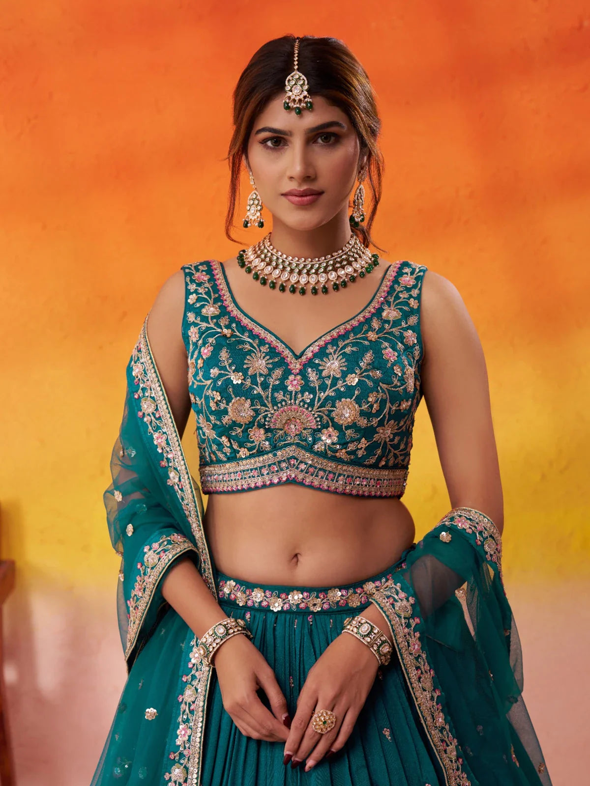 Tarani green georgette lehenga with sweetheart neckline blouse and mirror embroidery closeup