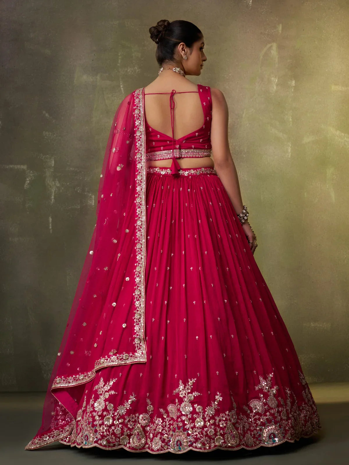 Tarani georgette lehenga back view with embroidered blouse and sheer dupatta styling