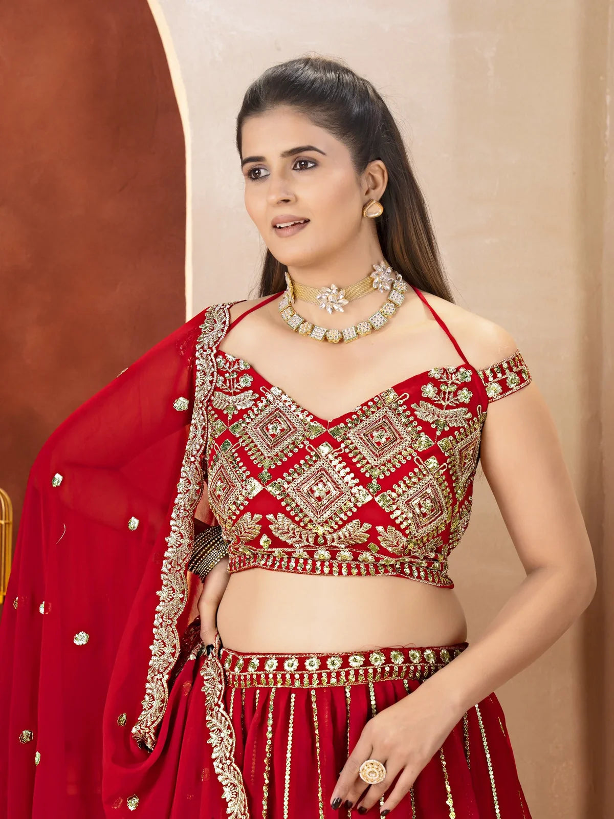Tarani red lehenga upper-body blouse with zari and sequin work for festive functions