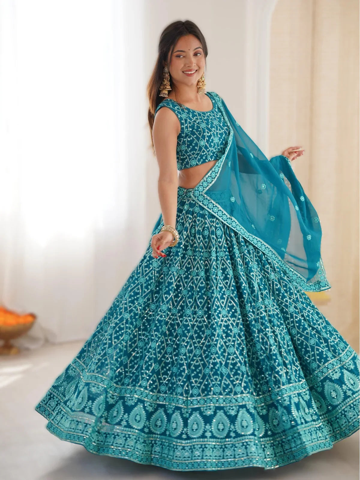 Tarani teal georgette lehenga full view with thread embroidery and 3.5 meter flair