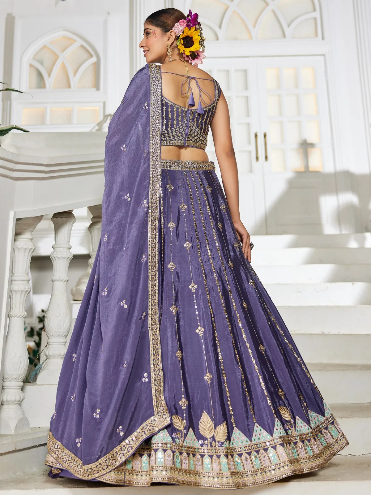 Tarani violet georgette lehenga back view with blouse tie-up and heavy embroidered dupatta