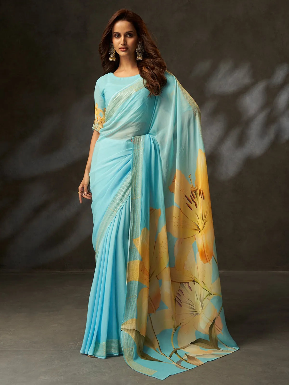 Tarani premium blue georgette saree full view with yellow floral design and matching blouse