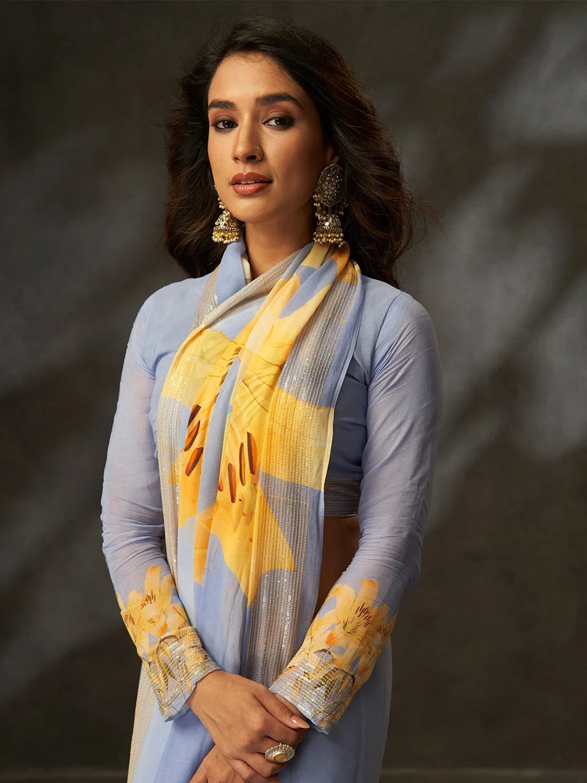 Tarani georgette saree upper body view with detailed blouse sleeve and soft fabric flow