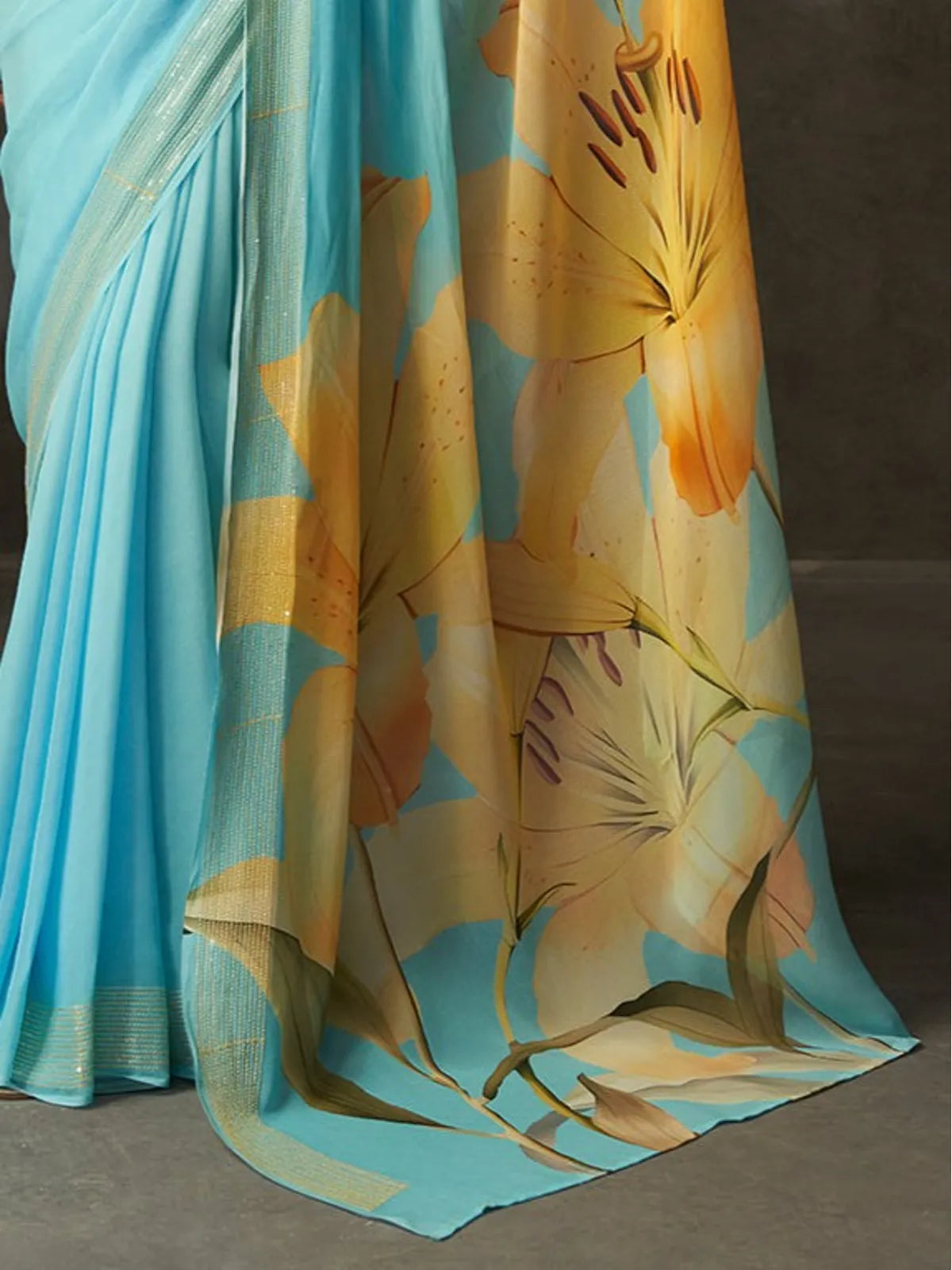Tarani premium blue georgette saree pallu view with yellow floral design and matching blouse