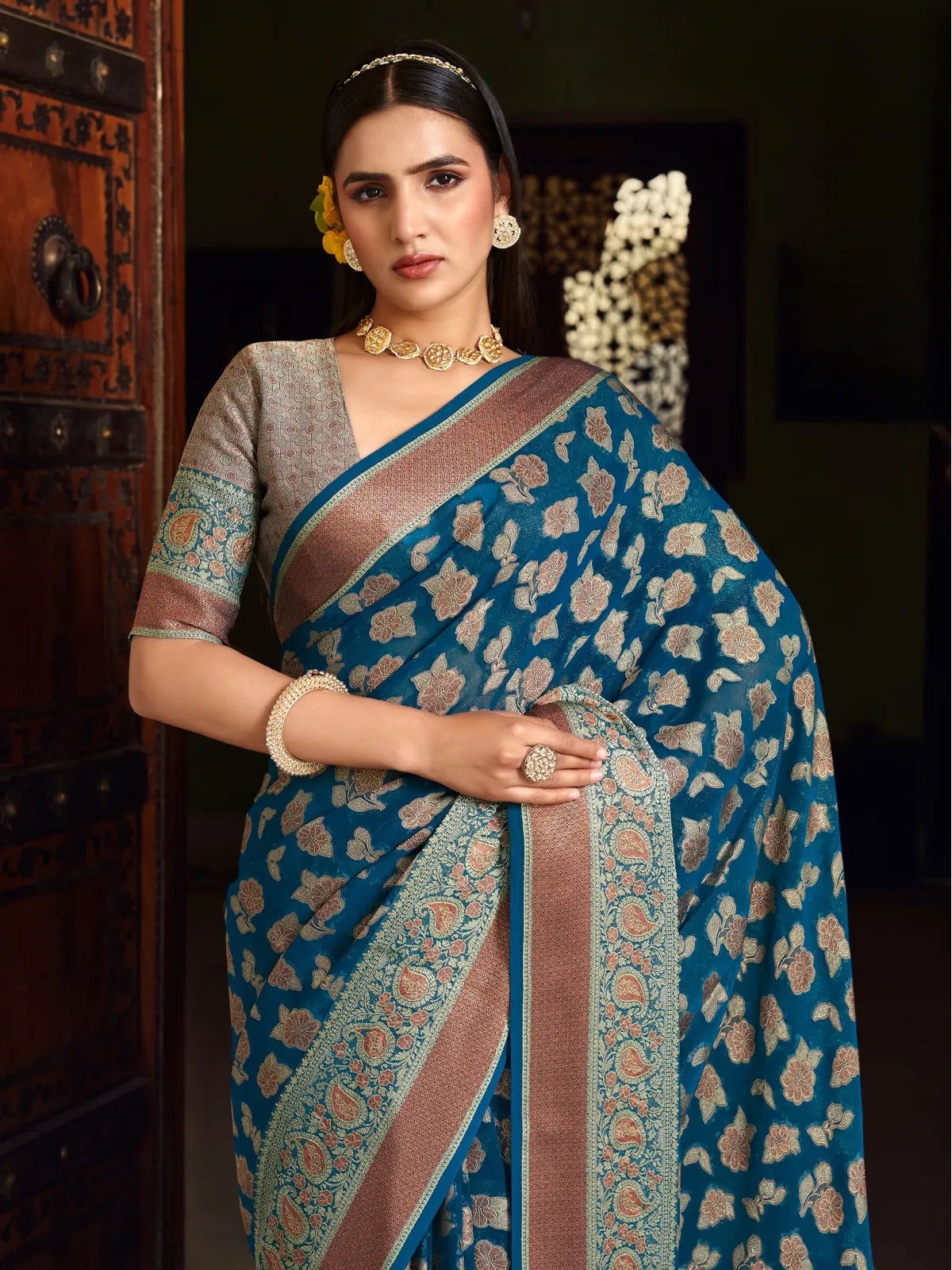 Tarani elegant blue georgette saree upper body view highlighting blouse and pallu detailing
