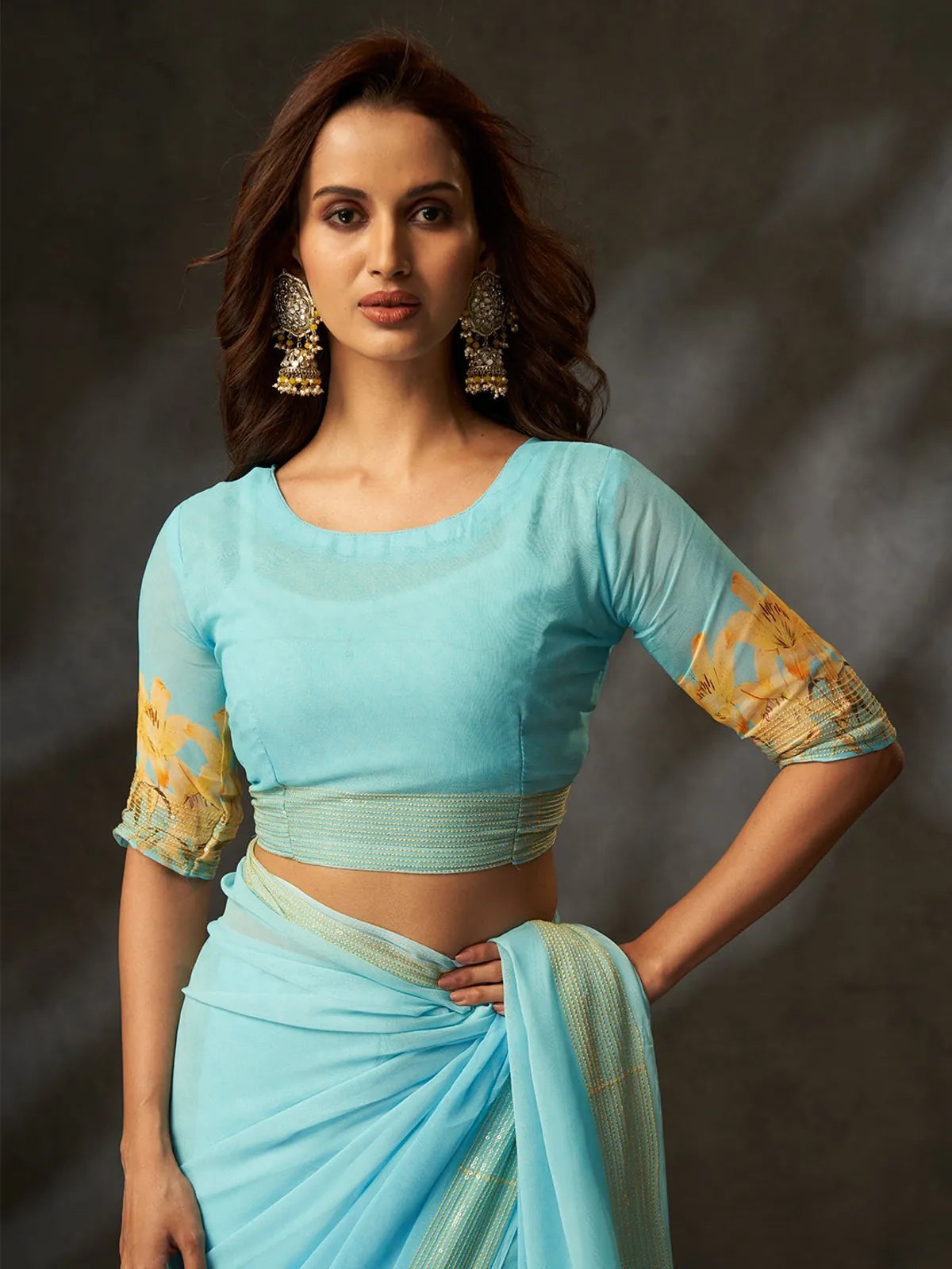 Tarani premium blue georgette saree upper body view with yellow floral design and matching blouse