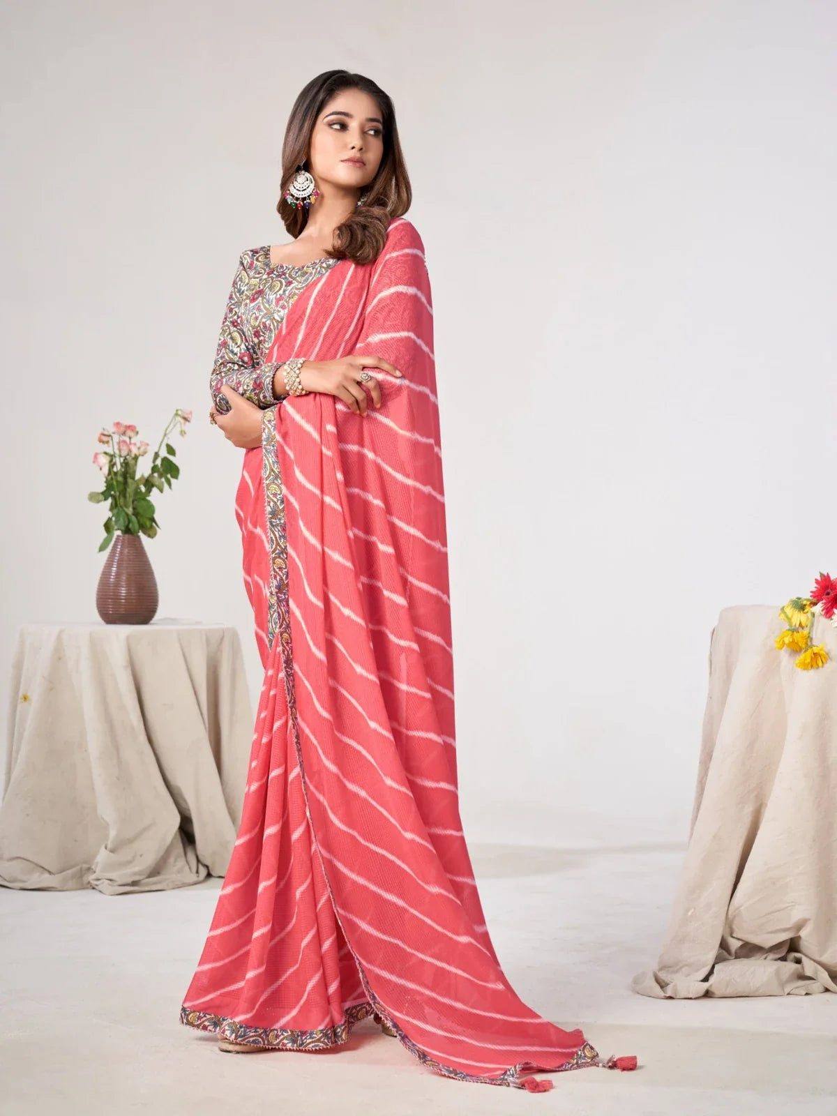 Tarani coral pink georgette saree with printed silk-blend blouse ideal for festive and party wear