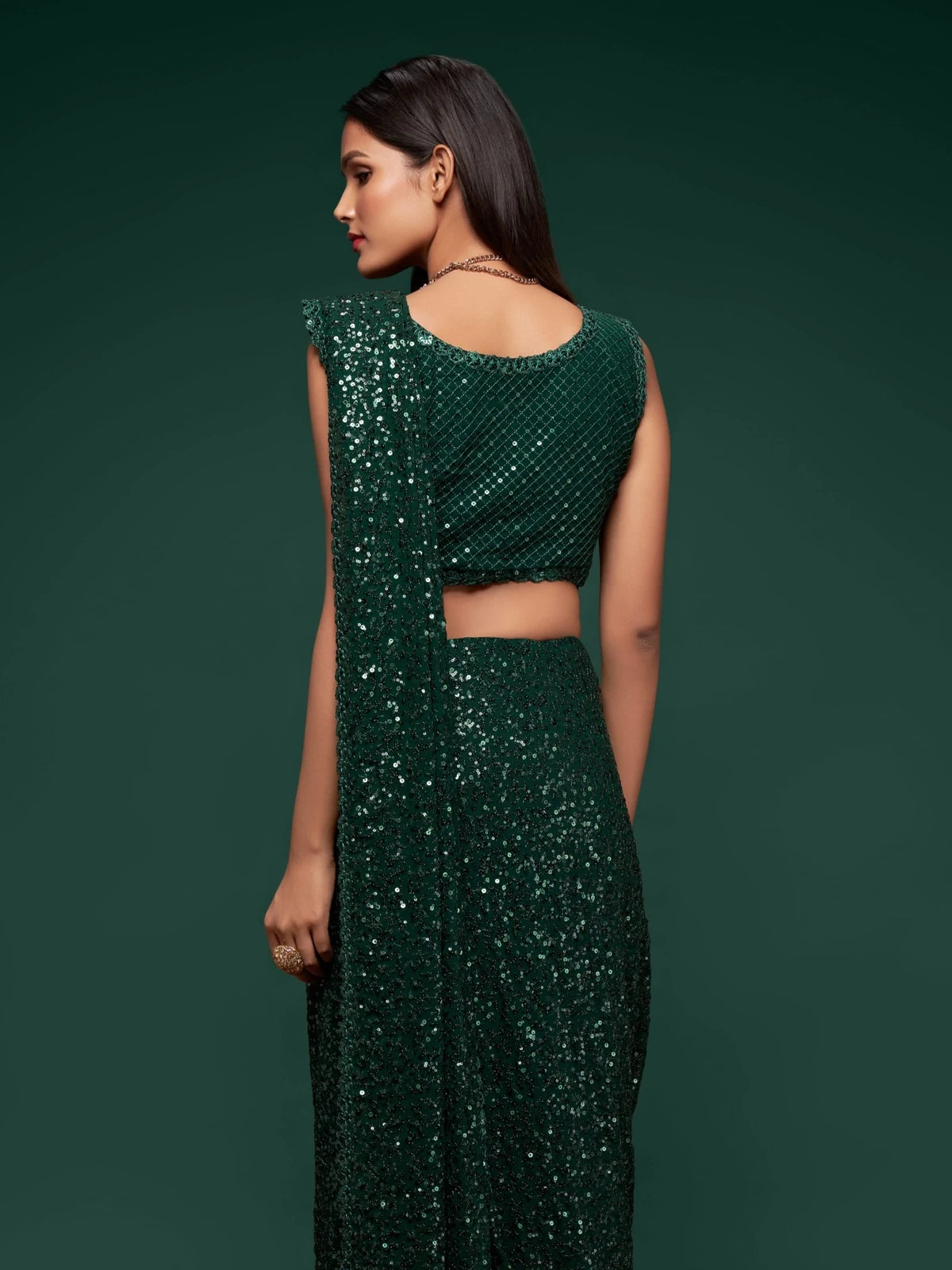 Tarani green georgette saree back view with embroidered blouse design for festive wear
