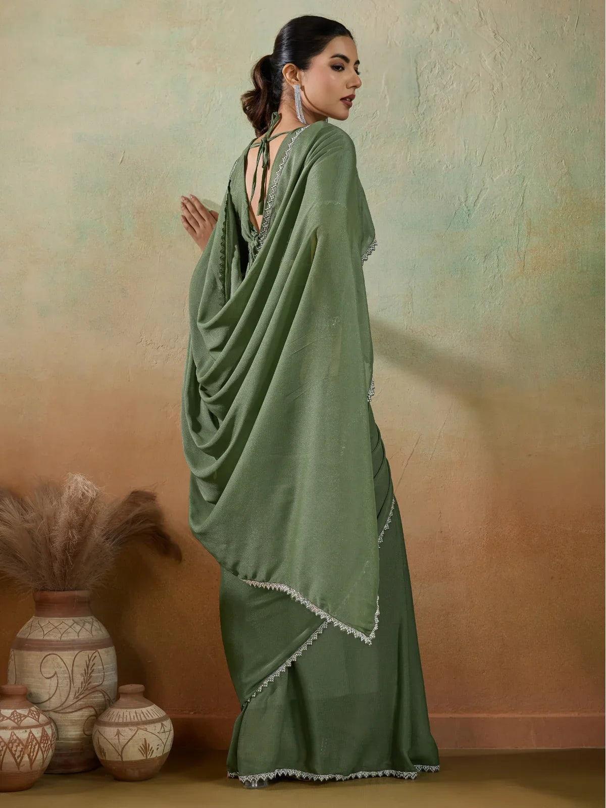 Tarani green georgette party saree with lace border back view