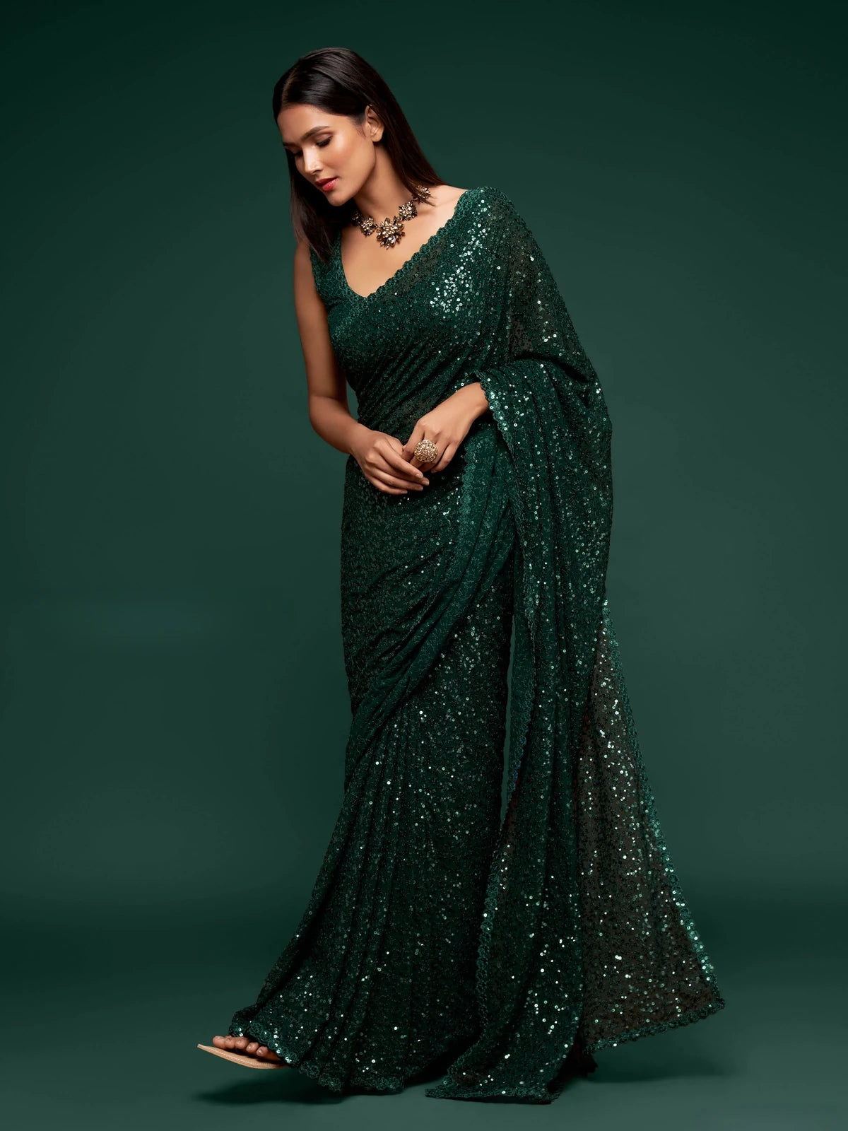 Tarani designer green georgette saree front view with elegant sequins embroidery