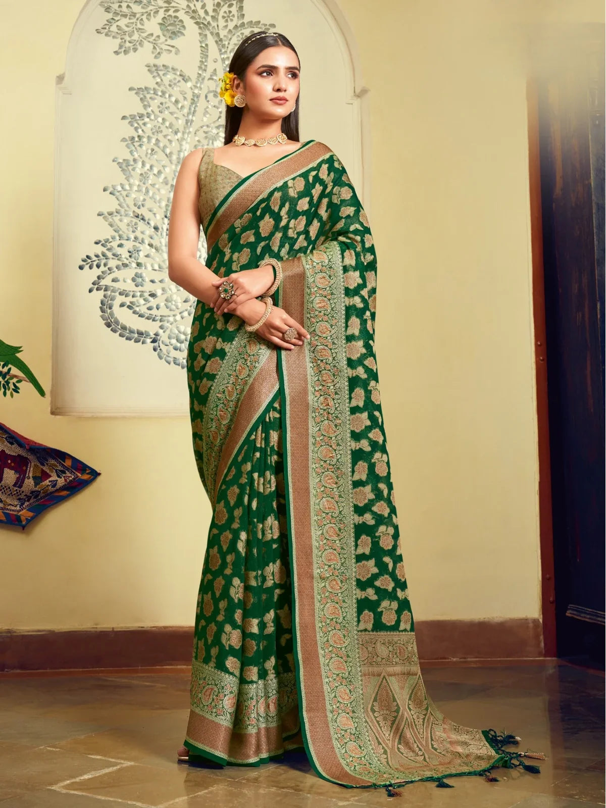 Tarani premium green georgette saree full view with golden woven border and pallu