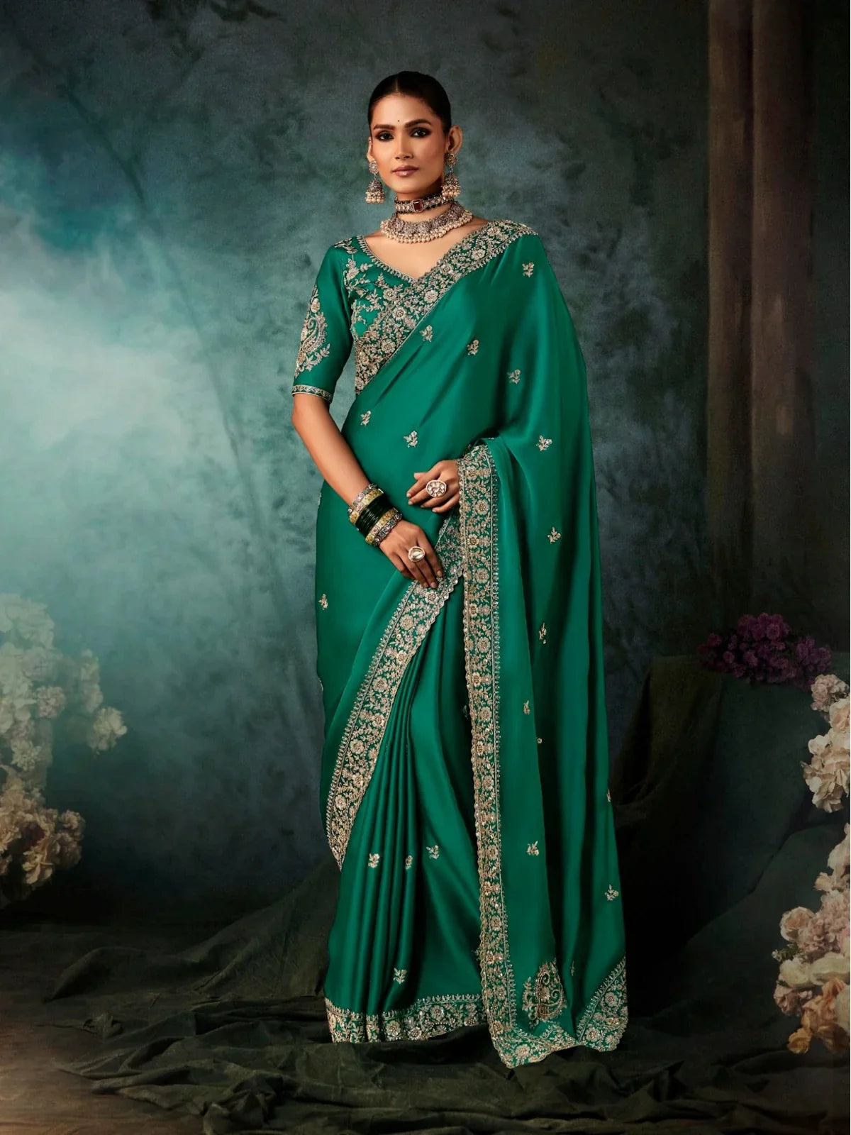 Tarani premium green georgette saree full view with intricate embroidery and matching blouse
