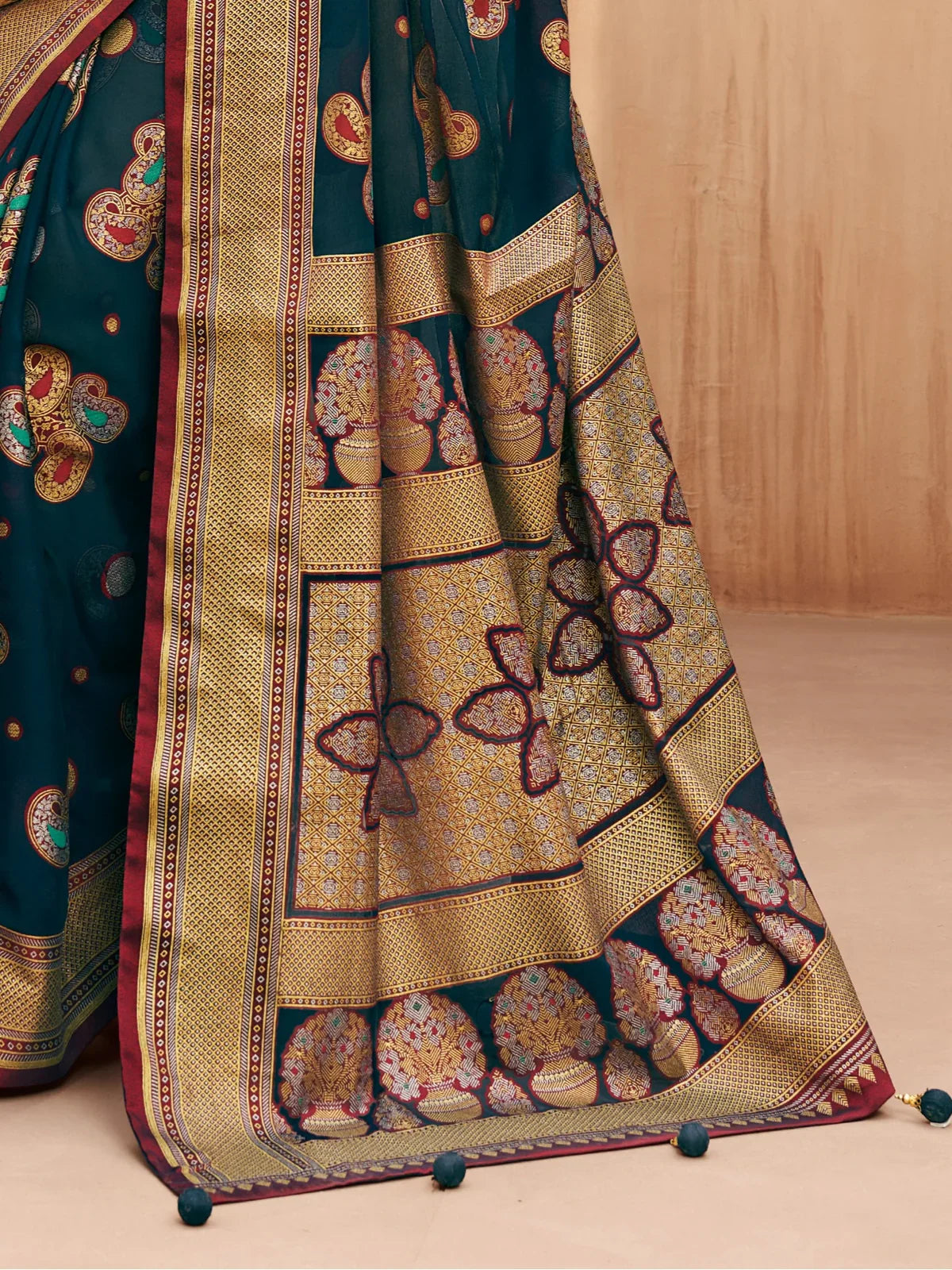 Tarani georgette saree pallu view with intricate border and traditional flower patterns