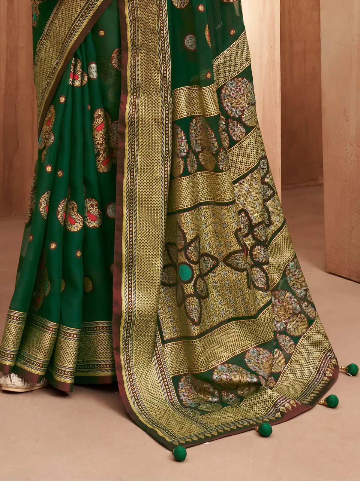 Tarani green georgette saree pallu with floral burnout design and pompom border