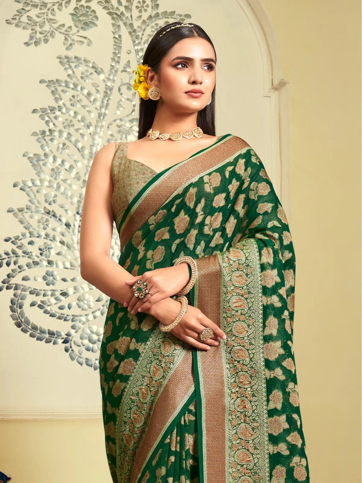 Tarani elegant green georgette saree upper body close-up showing intricate weave design