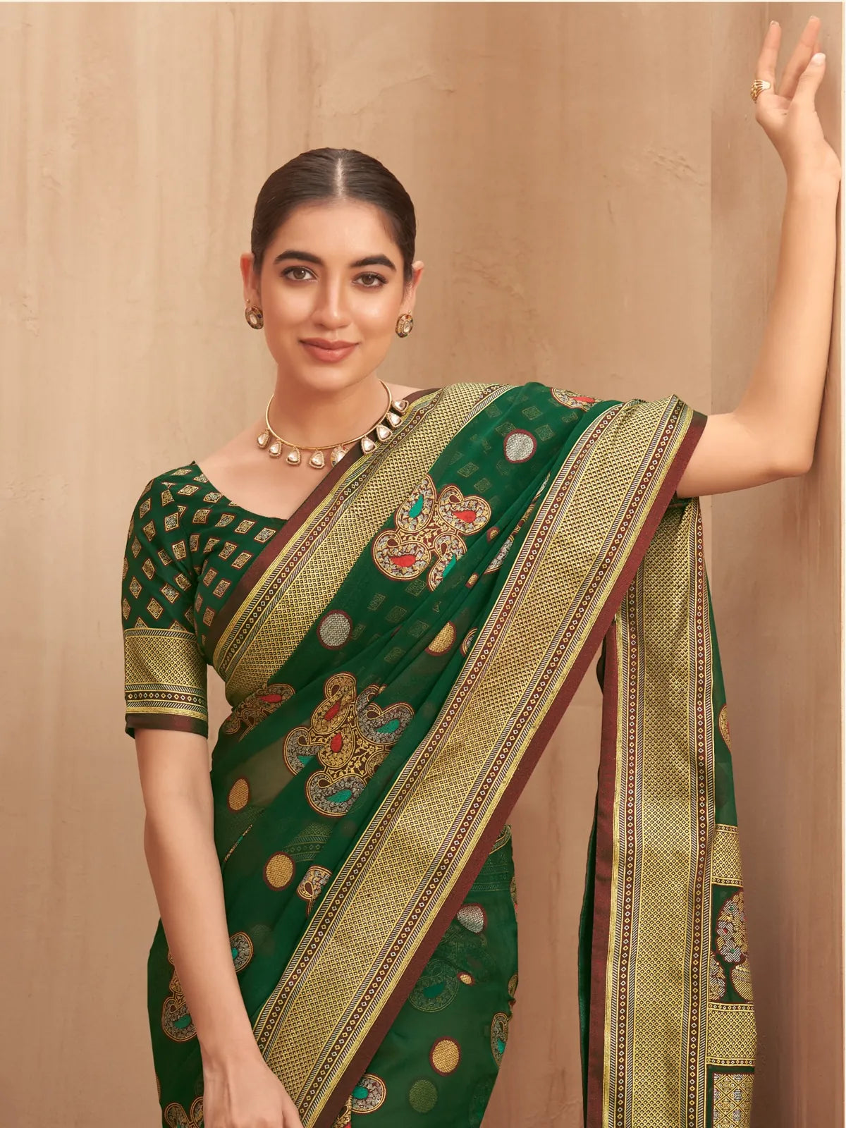 Tarani green georgette saree showing matching blouse and elegant neckline closeup