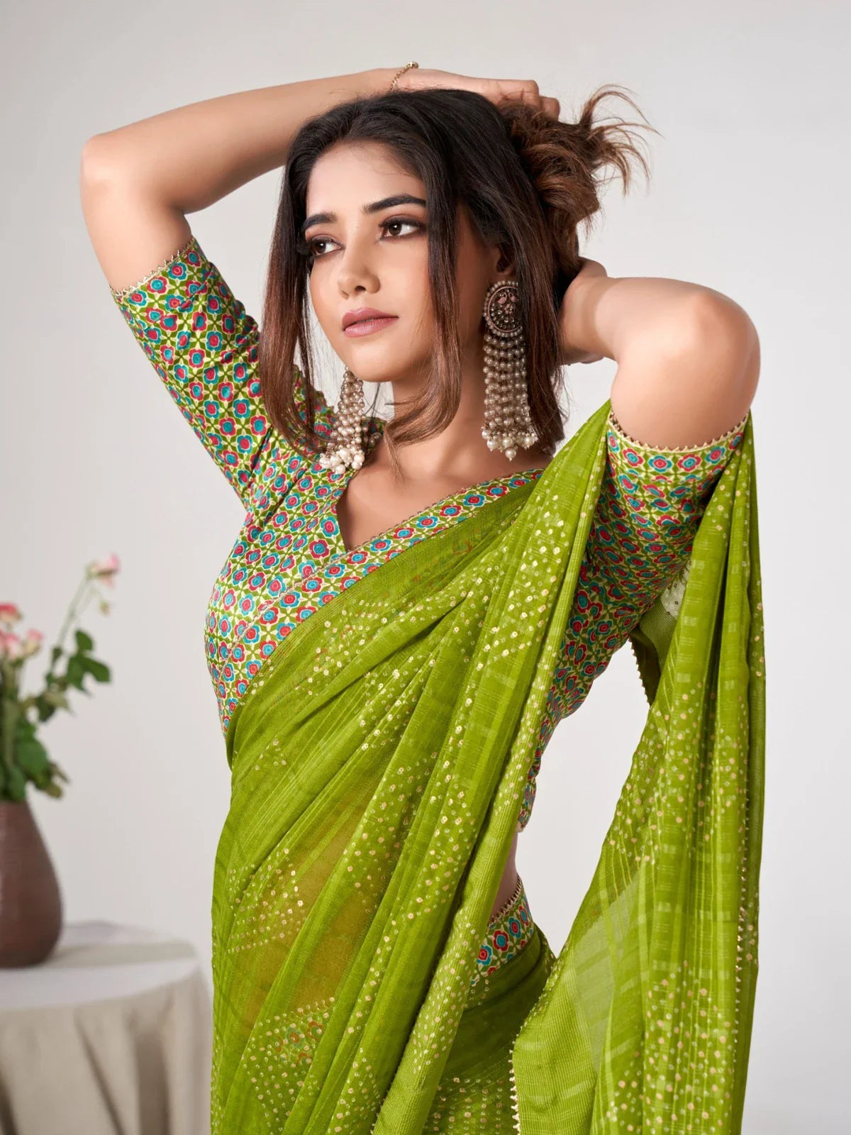 Tarani elegant green georgette saree with matching blouse upper body view
