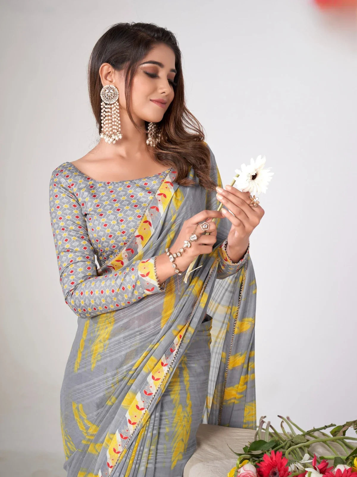Tarani premium grey georgette saree upper body view with yellow strokes and silk blend blouse