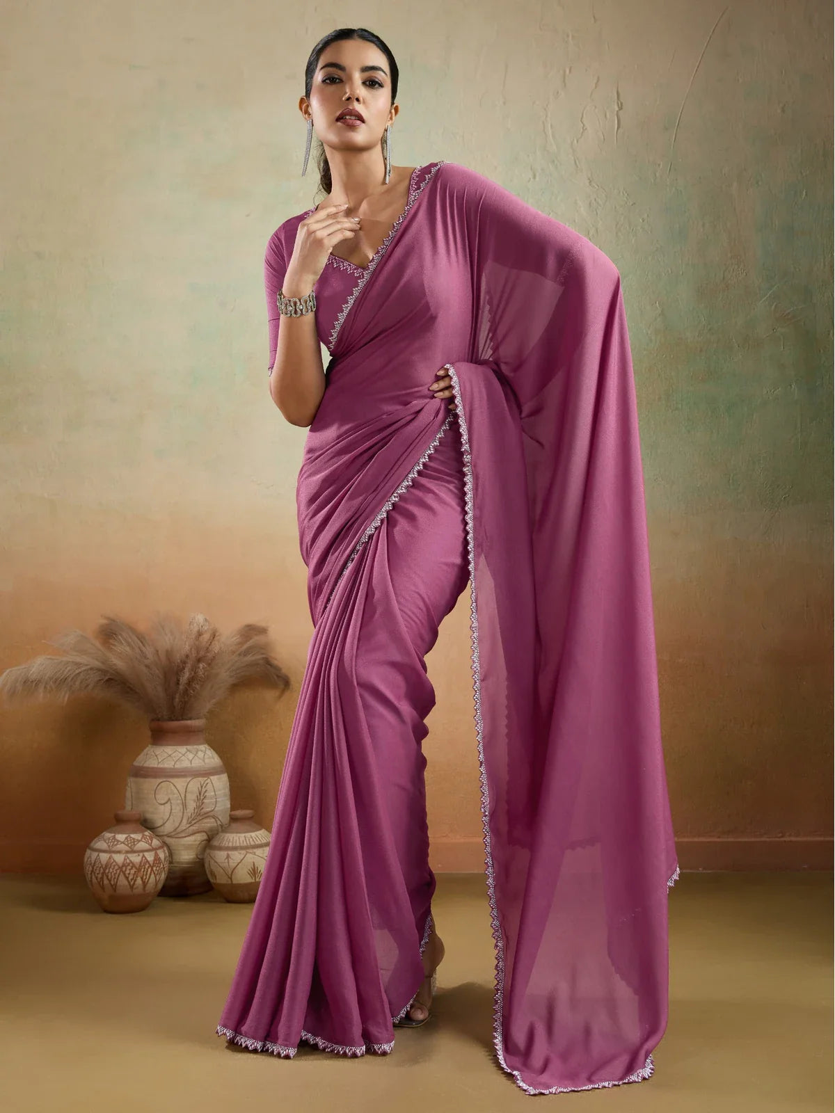 Tarani magenta georgette saree front view with lace border and party wear blouse