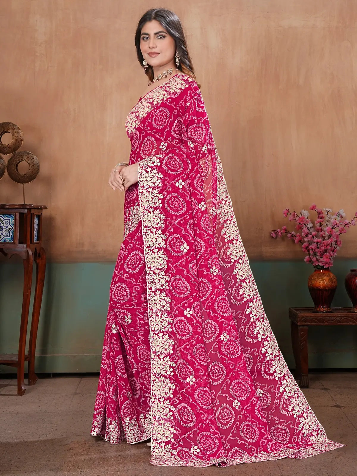 Tarani magenta georgette Bandhini saree graceful side view