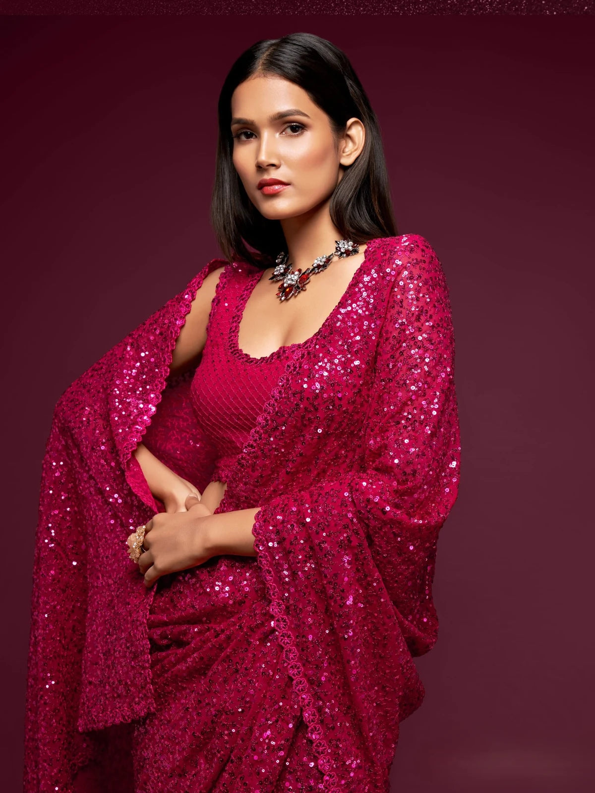 Tarani magenta georgette saree upper body view with embroidered blouse and sequins detailing