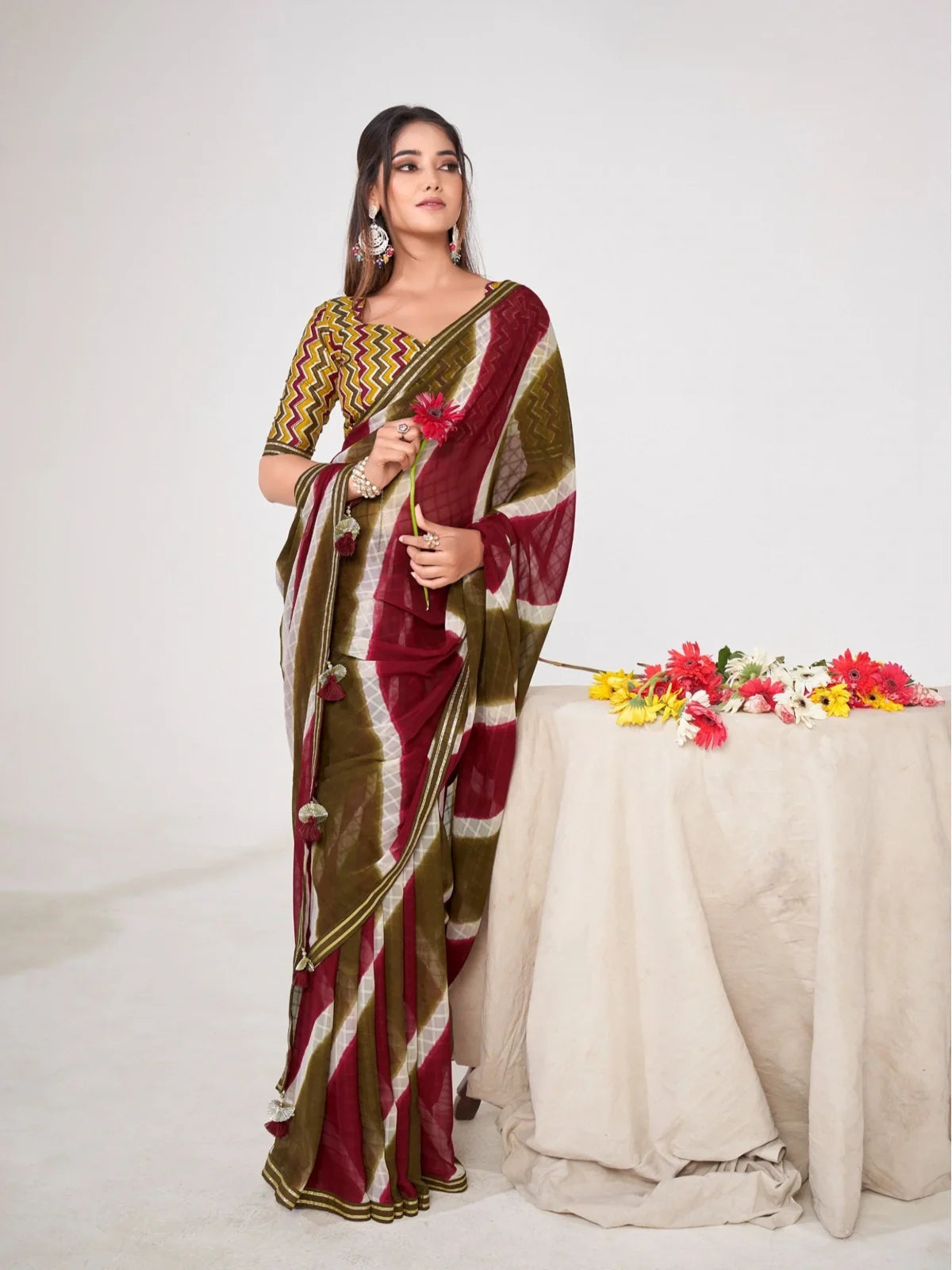 Tarani maroon and olive premium georgette saree with silk blend blouse for festive and party wear