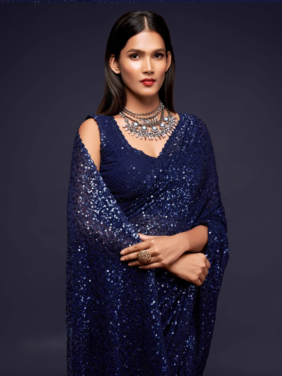 Tarani navy blue georgette saree upper body view with embroidered blouse and shimmer detailing