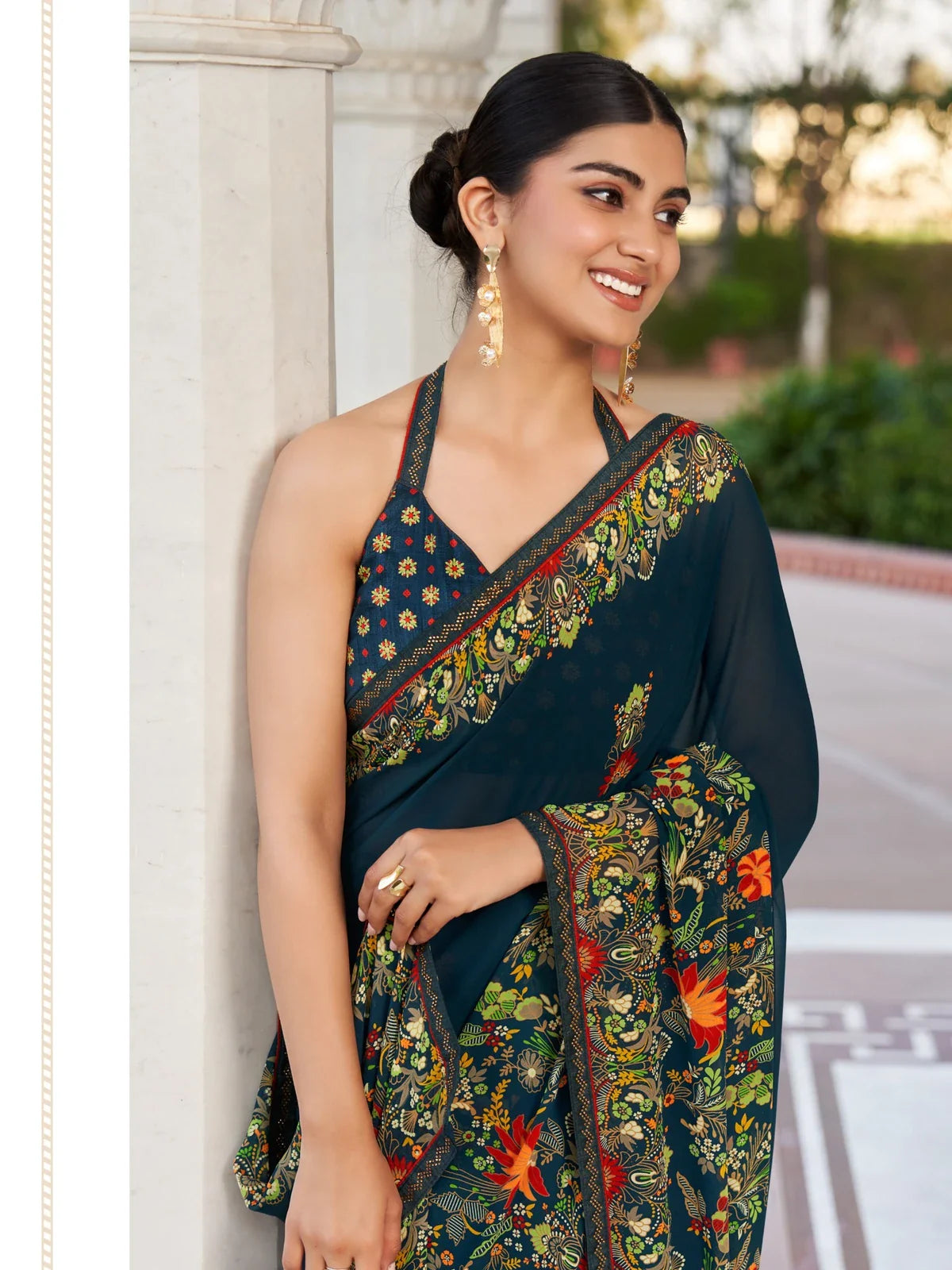 Tarani navy blue georgette saree upper body view with floral border and blouse