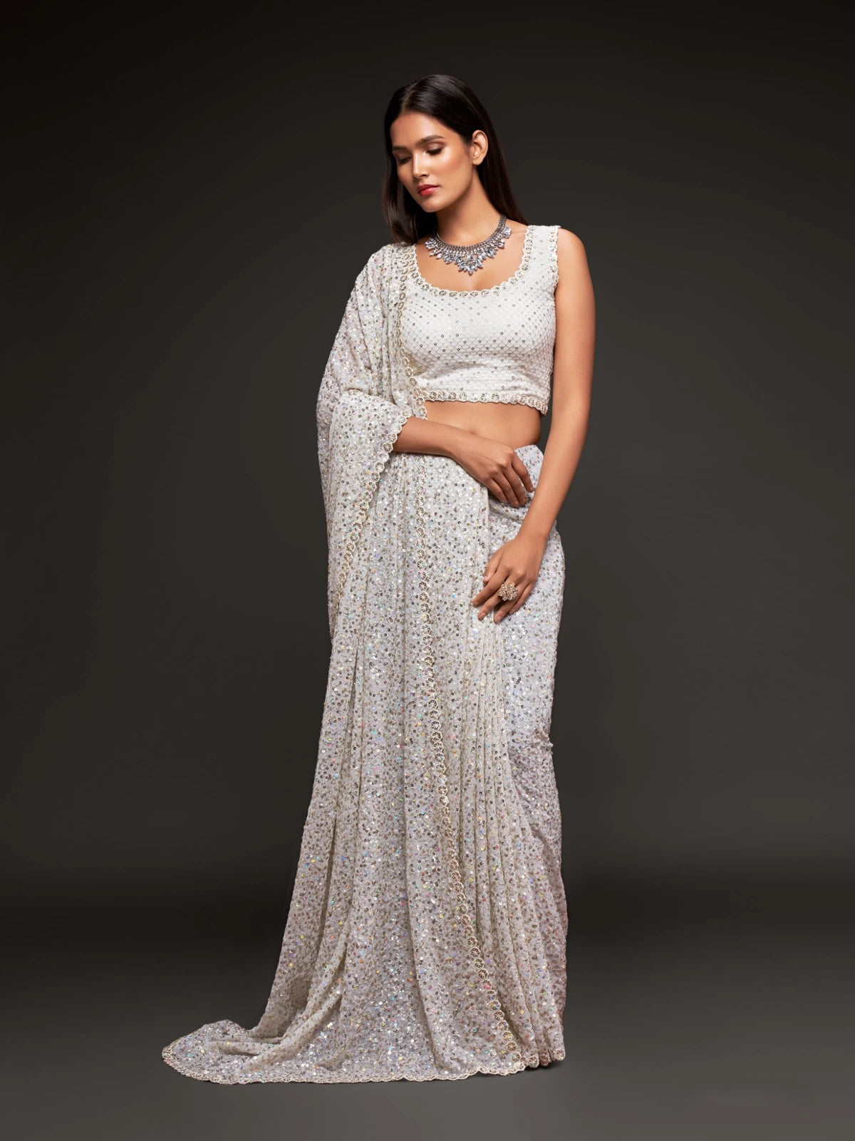 Tarani off white georgette saree front view with thread and sequins work