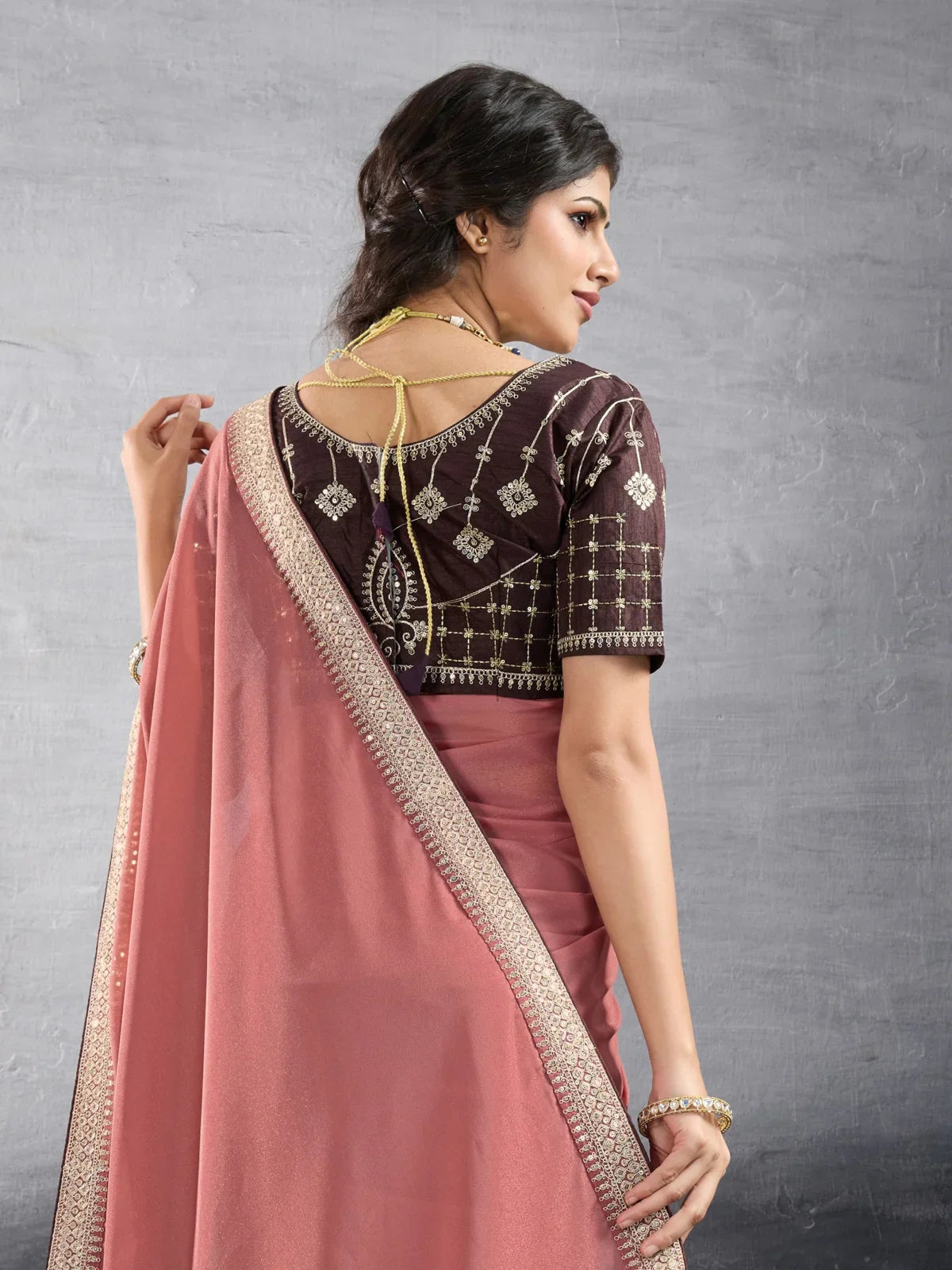 Tarani peach georgette saree back view showing detailed blouse embroidery