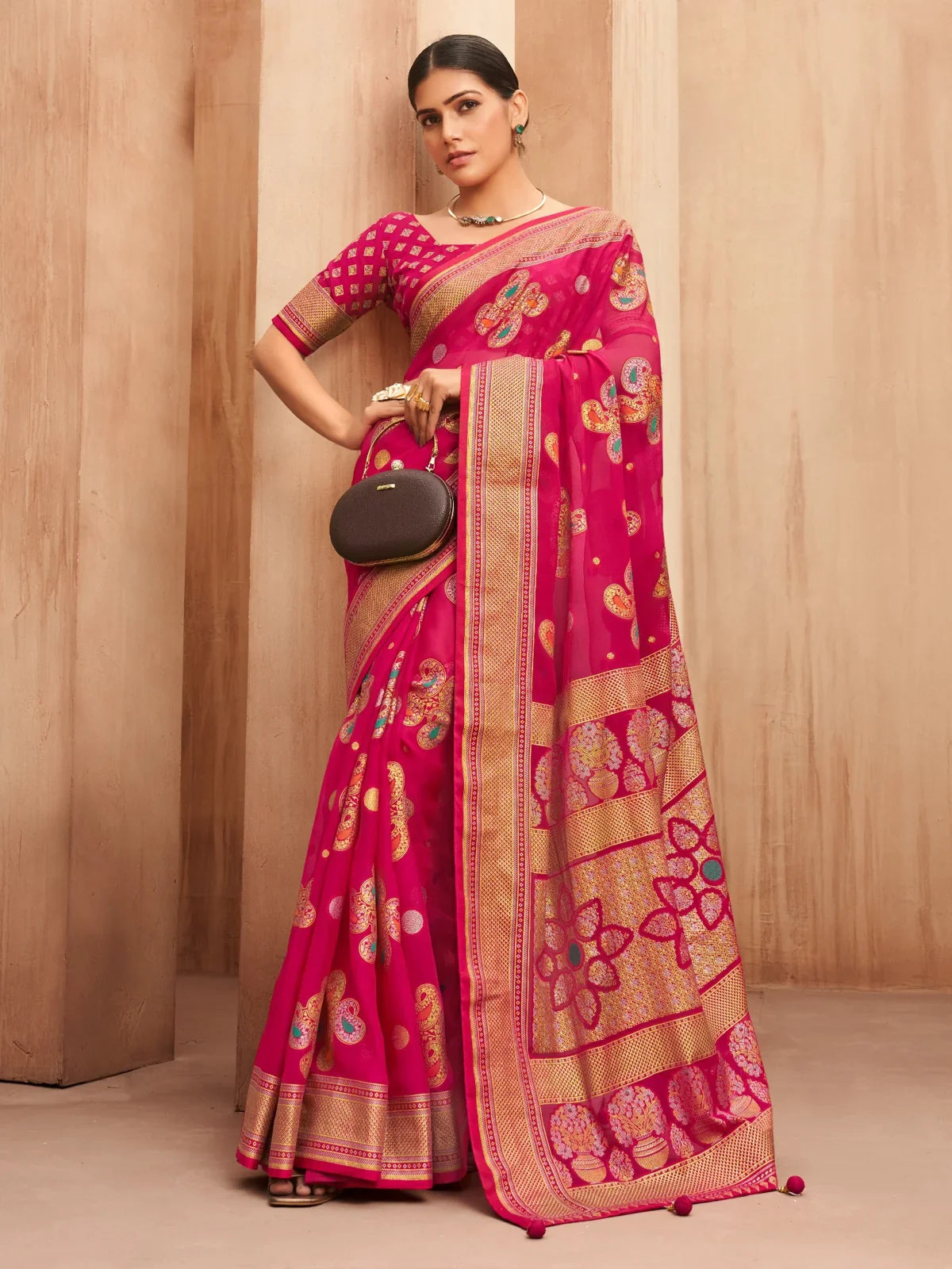 Tarani pink georgette saree full view with traditional motifs and zari border