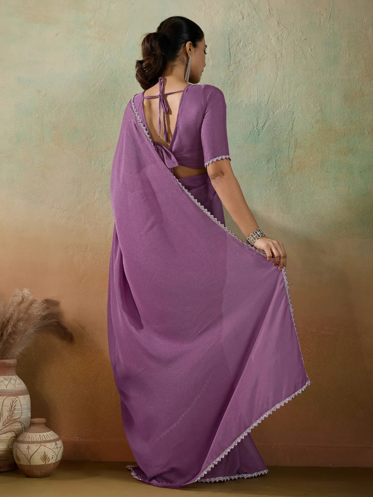 Tarani purple georgette saree with lace border back view highlighting blouse style