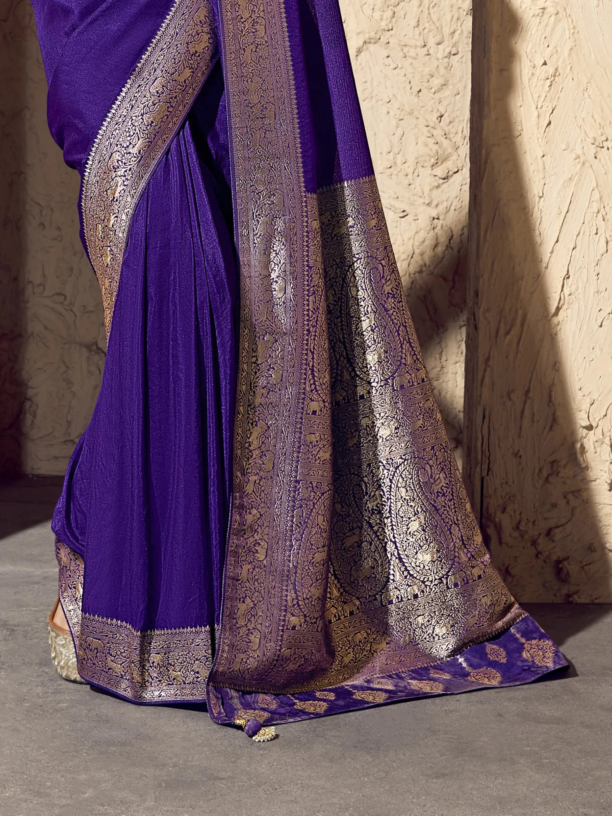 Tarani purple saree pallu close-up with rich zari weaving for festive events