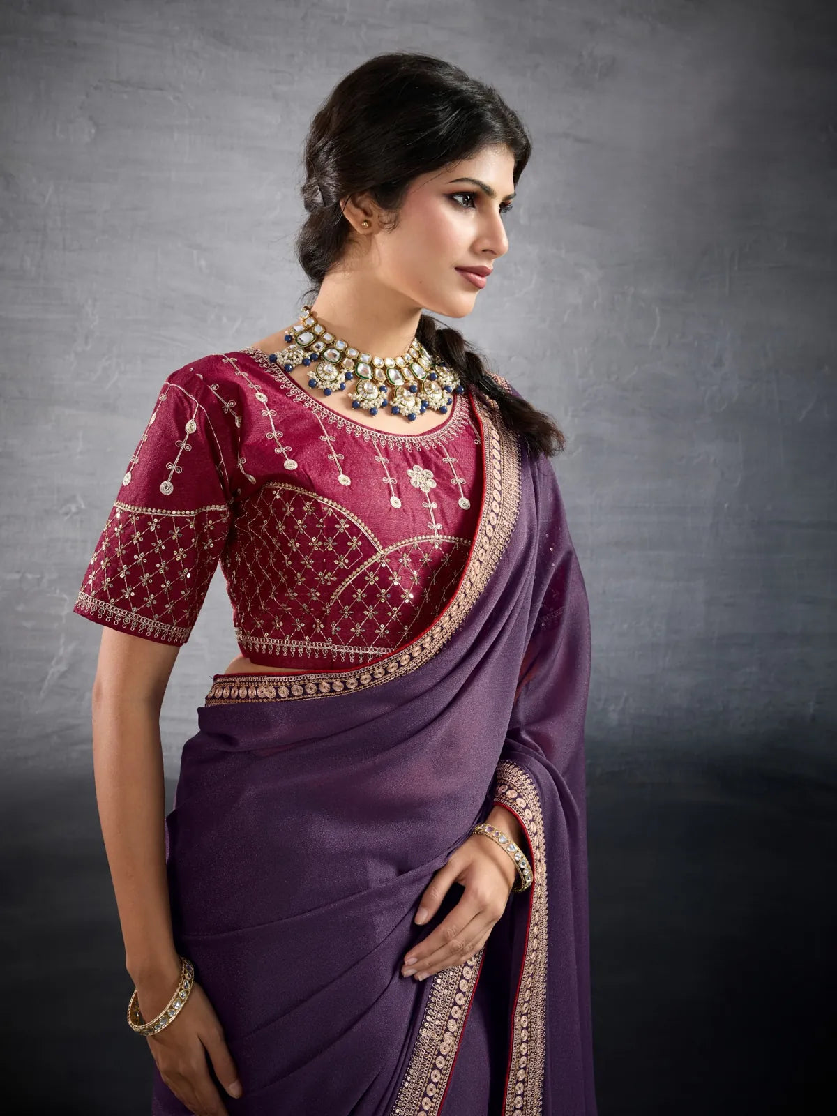 Tarani purple georgette saree upper body view with embroidered blouse
