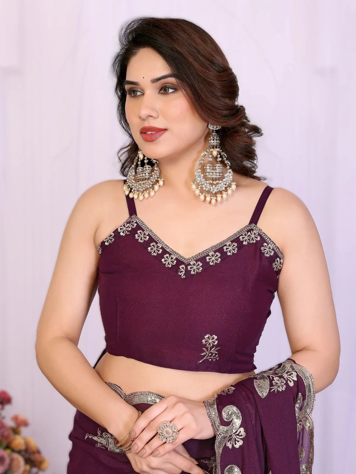 Tarani purple georgette saree with embroidered blouse upper body close view