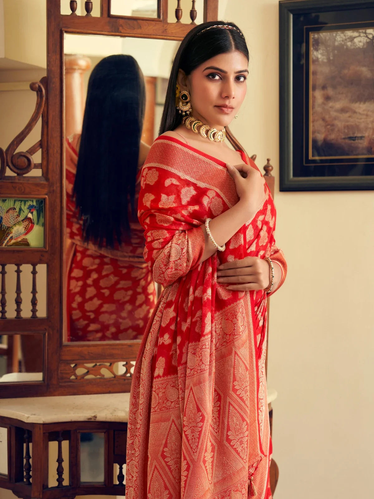 Tarani red georgette saree upper body close-up showcasing pallu and elegant drape