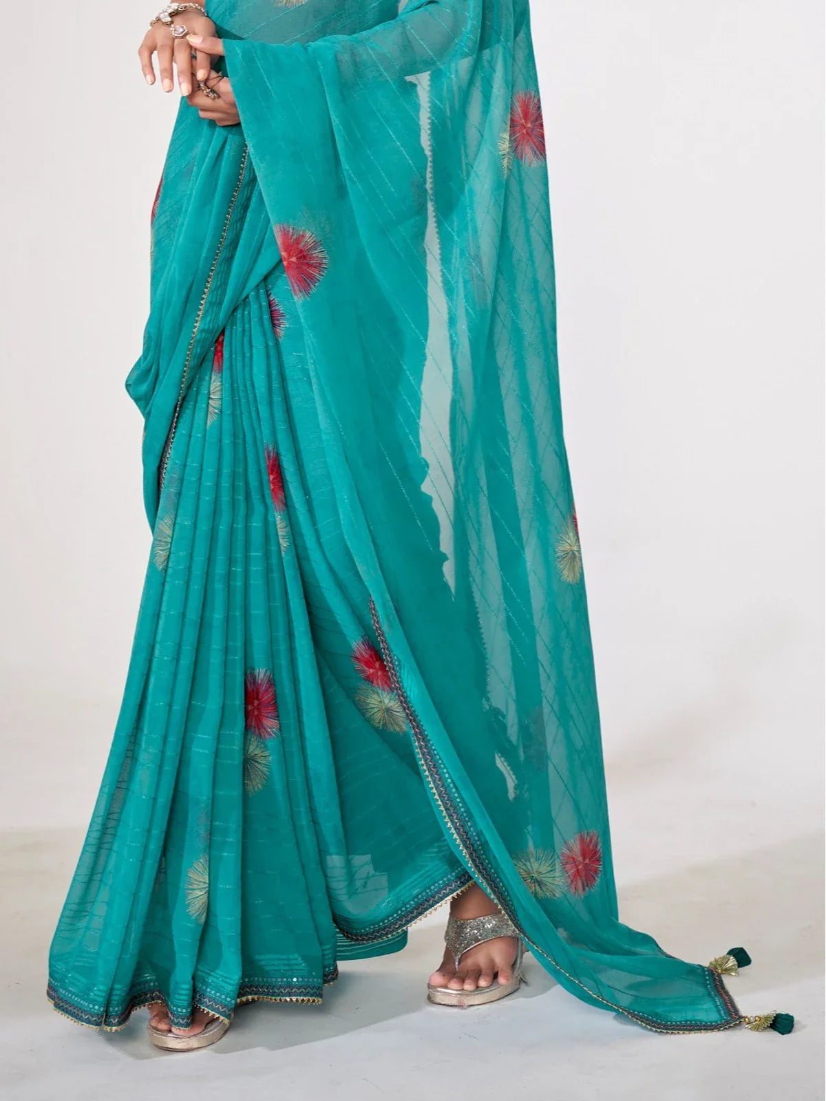 Tarani teal georgette saree closeup view showcasing fine thread work and detailing