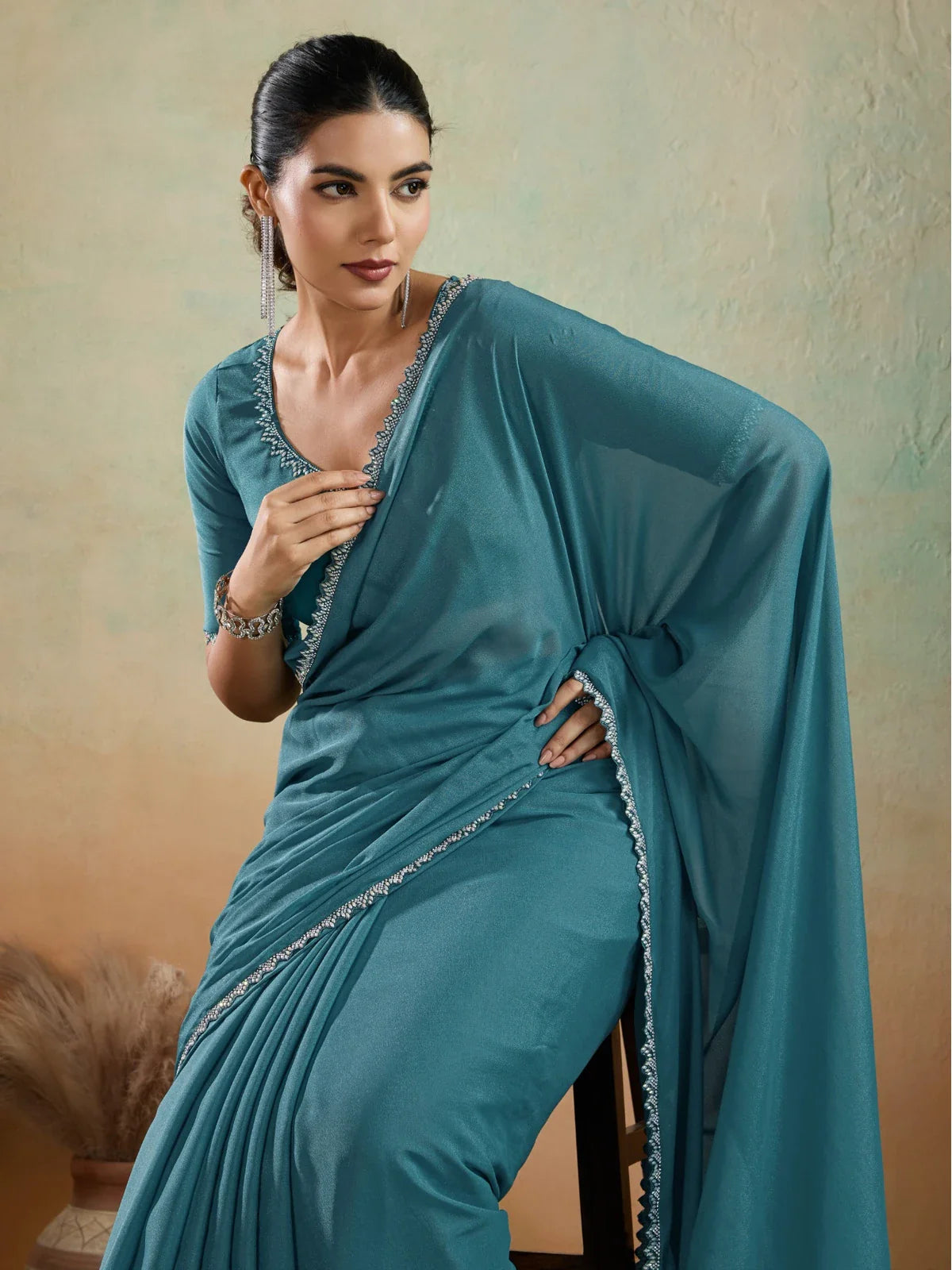 Tarani teal georgette saree with lace border upper body view