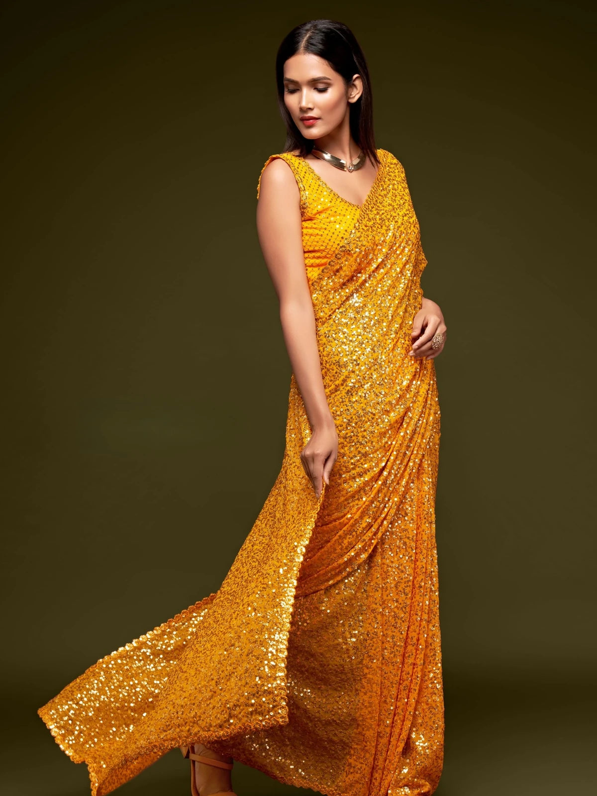 Tarani yellow georgette saree pallu detail with rich sequins embroidery work