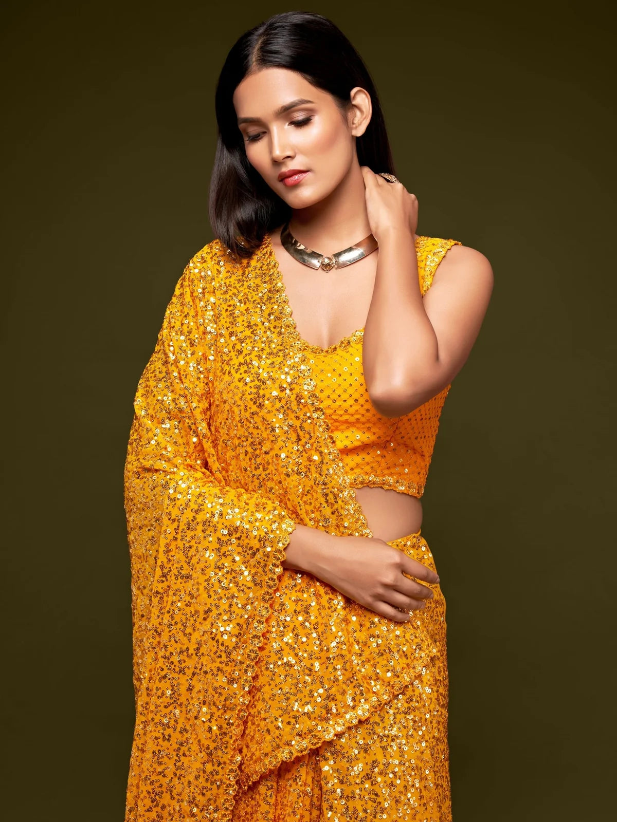 Tarani yellow georgette saree upper body view with sparkling sequins embroidery blouse