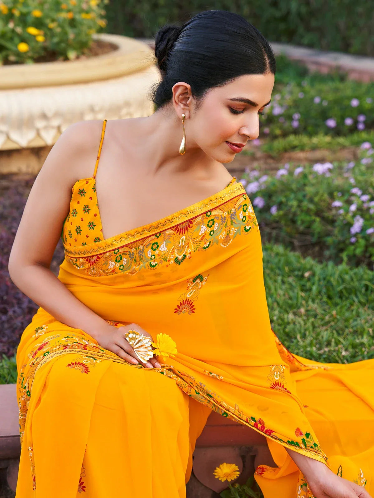 Tarani yellow georgette saree upper body view with floral print and patch border work
